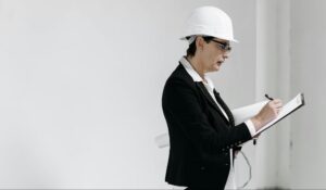 Construction manager reviewing financial records for cash flow control.