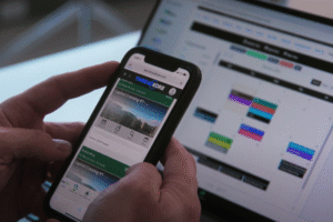 Mobile view of the ThreadKore platform displaying project details alongside a desktop dashboard with scheduling and financial data, illustrating integrated construction accounting services and construction management services in real time.