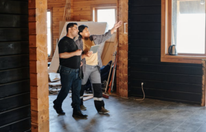 Construction team reviewing site plans with improved coordination using construction CRM for real-time decision making and error prevention
